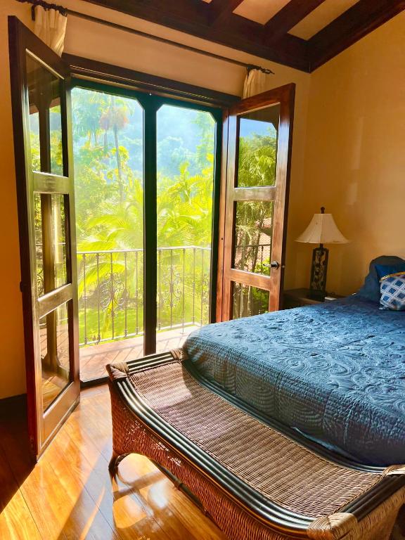 Bedroom with jungle balcony view