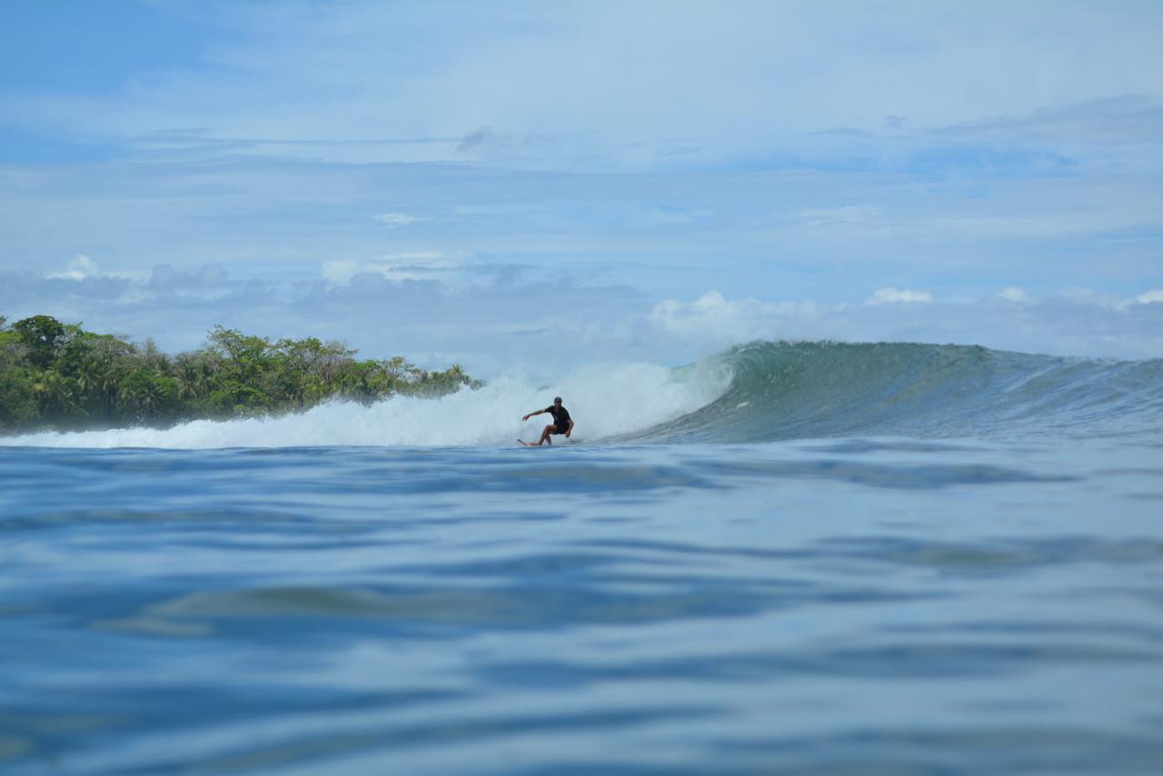 Oscar surfing Pavones point break in Costa Rica